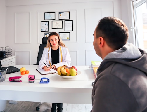 A professional lawyer consulting with a client in a modern office.